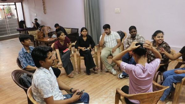 A small group seated in a circle