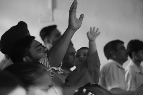 Hands raised in prayer
