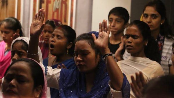Women worshipping together